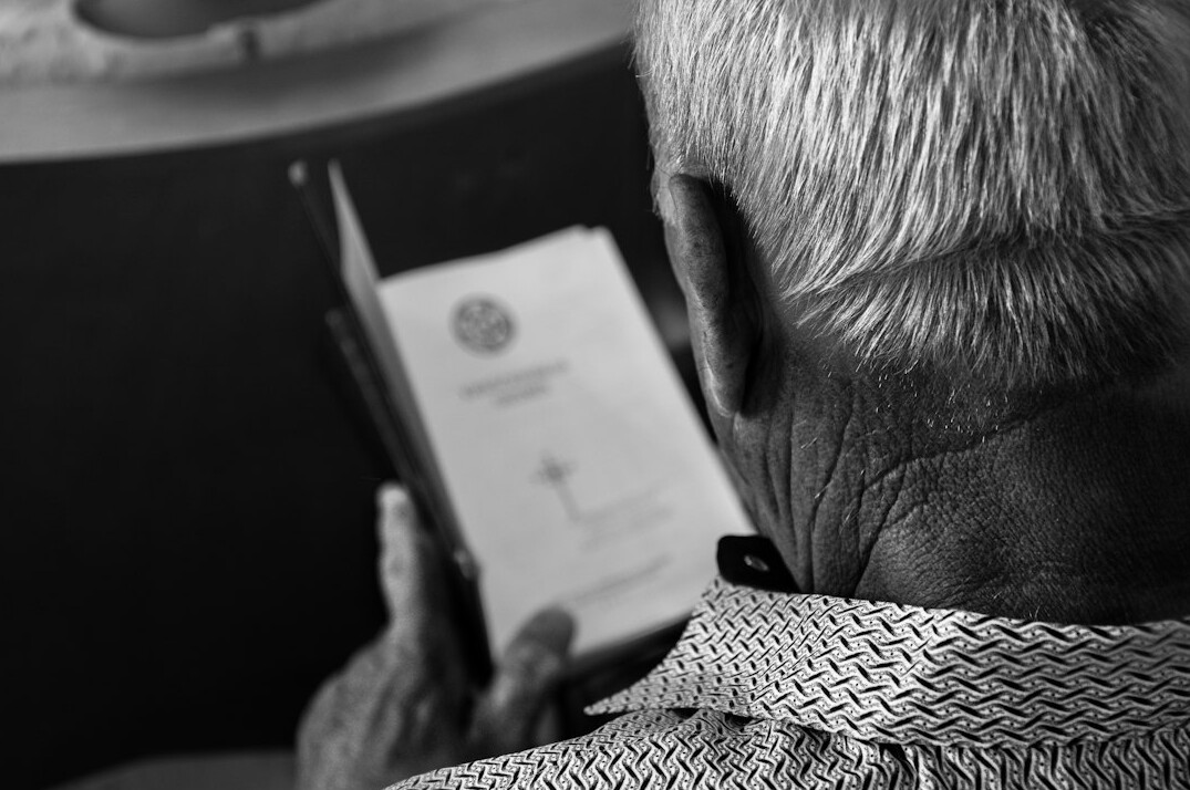 elderly person checking documents